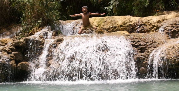 Kid Jumping Small Waterfall