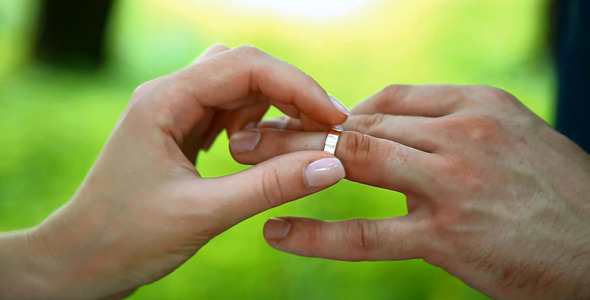 Bride and Groom Hands Exchanging Wedding Rings