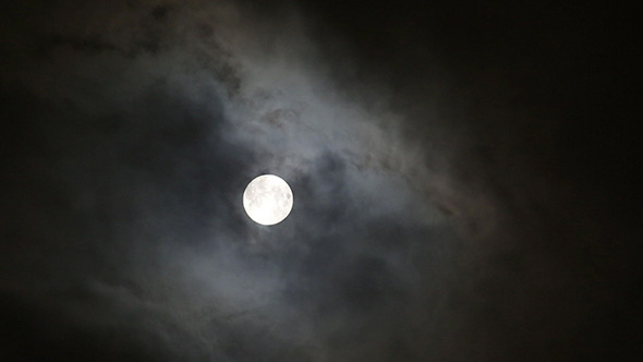 Moon Between Clouds