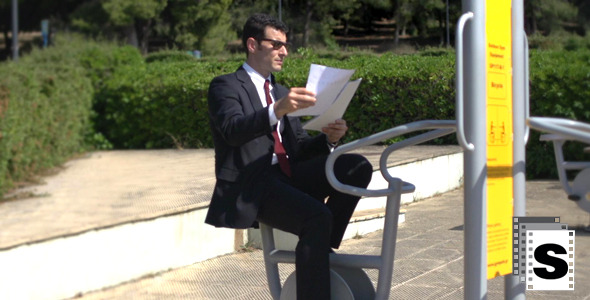 Businessman Working Whilst Training alt