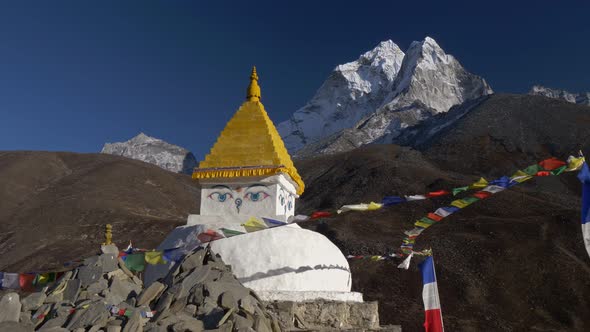 Buddhist Stupa with Prayer Flags on Track To the Base Camp of Everest (EBC) in the Himalayas, Nepal