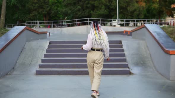 Funny Dancing Girl in the Street or Park in Front the Stairs