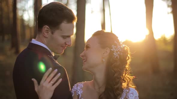 Loving couple in the woods, happy brides, wedding day