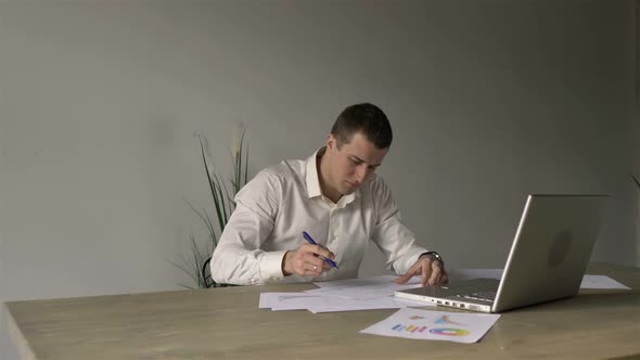 businessman working with papers in his office