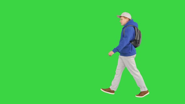 Young Boy Wearing a Backpack Walking To School on a Green Screen, Chroma Key