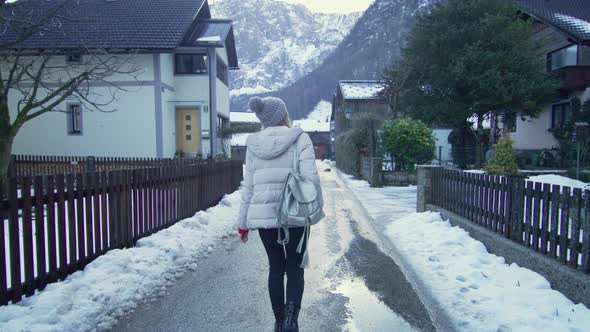 Woman tourist in Hallstatt village on winter