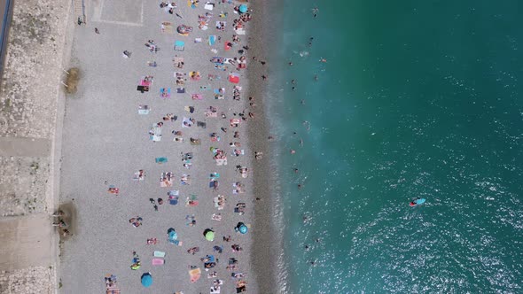 Nice beach in southern France full of people, aerial shot