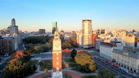 Iconic Torre Monumental in Buenos Aires stands proud in early morning sun; drone