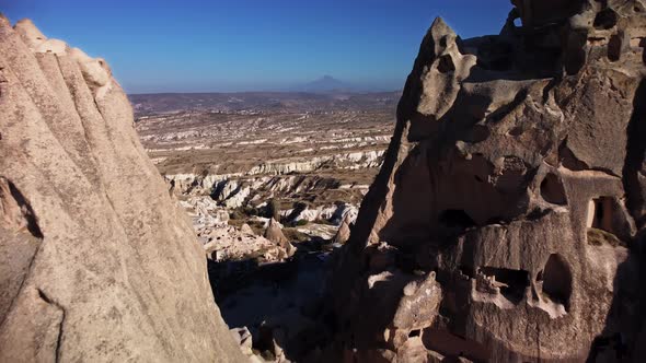 Drone Footage of Huge Limestone Cone Rocks with Caves in Them Located in Uchisar Town