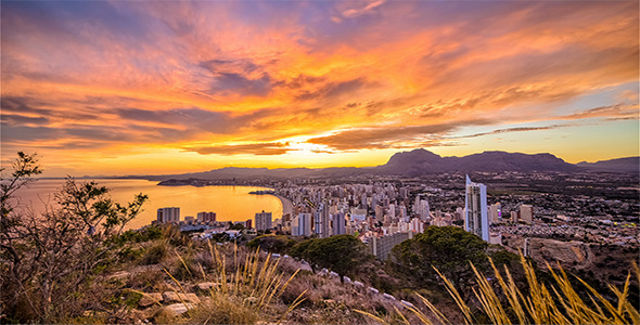 Colorful Sunset above Modern City Skyline and Nature