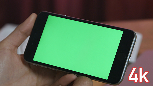 Girl Holding Smartphone with Green Screen alt