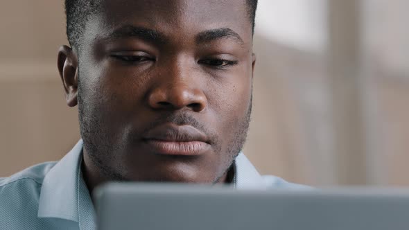 Serious Male Young African American Businessman Programmer Typing on Computer at Home Office Focused