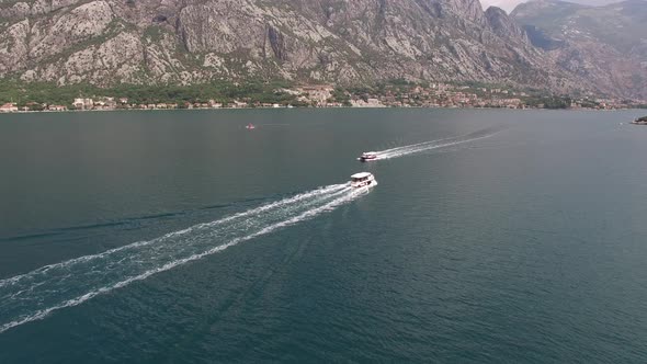 Boats Sail on the Kotor Bay Off the Coast of the Town of Prcanj
