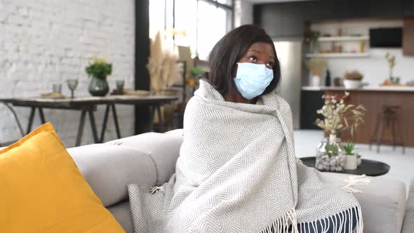 Full Length View of Young Sick Woman Wearing Protective Face Mask Feeling Unwell at Home