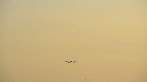 Plane Landing after Sunset