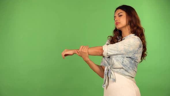 A Young Beautiful Caucasian Woman Stretches  Green Screen Background