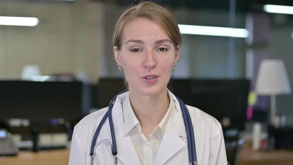 Portrait of Beautiful Young Female Doctor Doing Video Chat