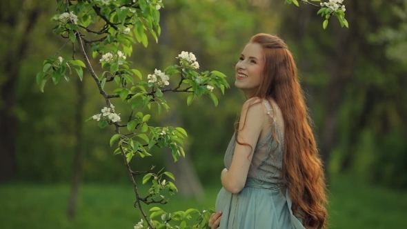 Young  Pregnant Woman Relaxing And Enjoying Life