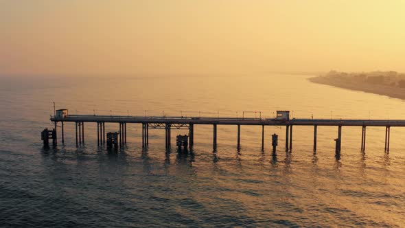 Aerial view of jetty at sunset
