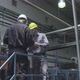 Factory workers discussing with each other in factory - VideoHive Item for Sale