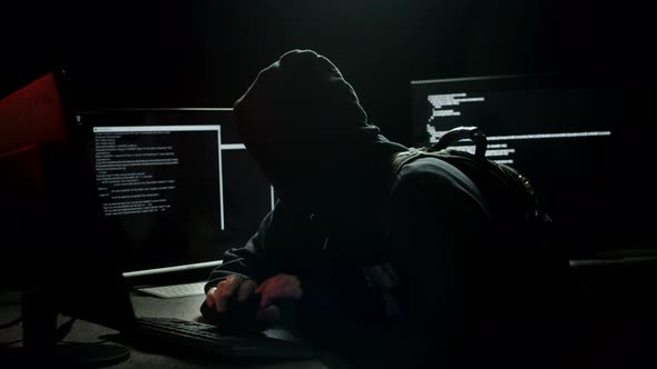 Hacker Infiltrating Computer Systems Stealing Data