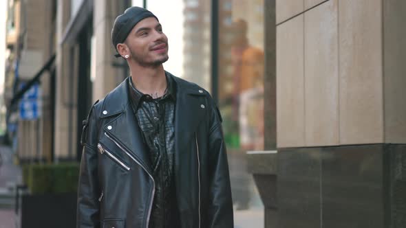 Dolly Shot of Smiling Confident Gay Man Strolling on City Center Street Leaving