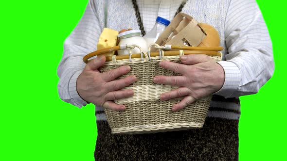 Hands of Farmer Holding Basket of Dairy Products