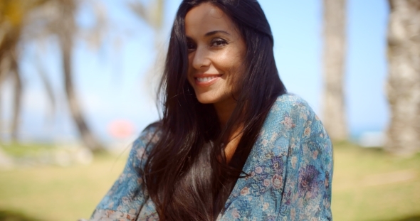 Happy Pretty Long-Haired Woman At The Beach