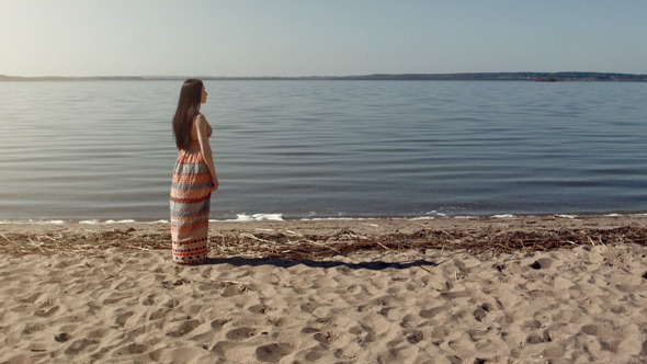 Young Woman Walking Near The Sea