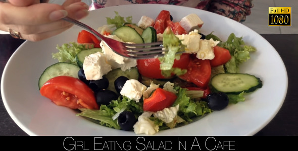 Girl Eating Salad In A Cafe 6