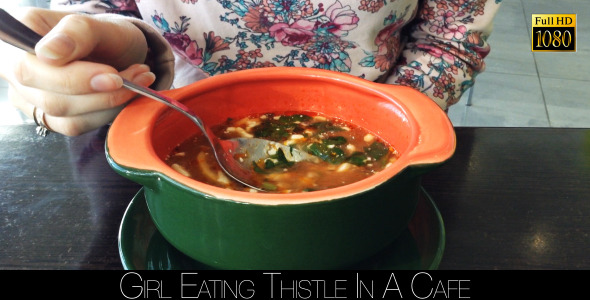 Girl Eating Soup In A Cafe