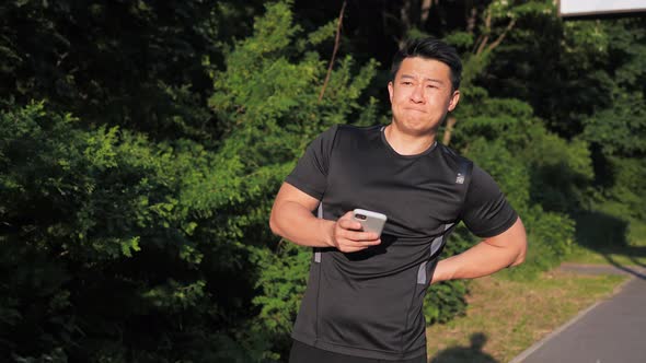 Young Asian Sportsman Have Shoulder Pain Injury After Running at Sunset