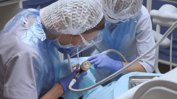 Dentist operation room, female patient , working hygiene disinfecting procedure