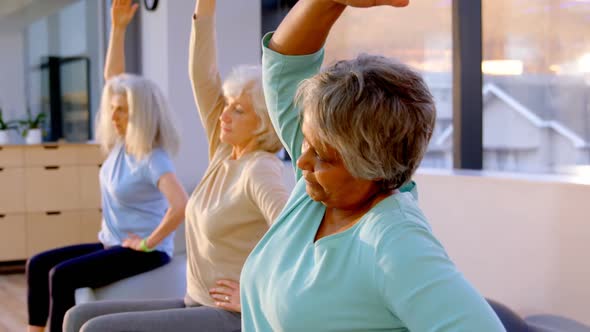 Senior women performing yoga 4k