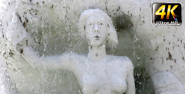 Waterfall and Ancient Marble Stone Woman Statue