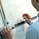 Man Draws a Technical Drawing on Drawing Board - VideoHive Item for Sale