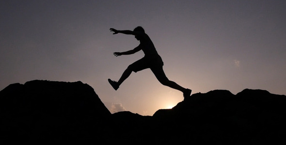 The Silhouette Of Man Jumping