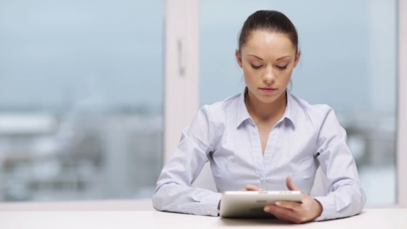 Business Woman With Tablet Pc In Office