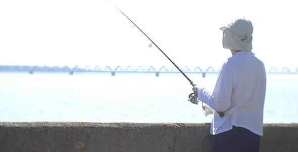 Fisherman On City Riverside