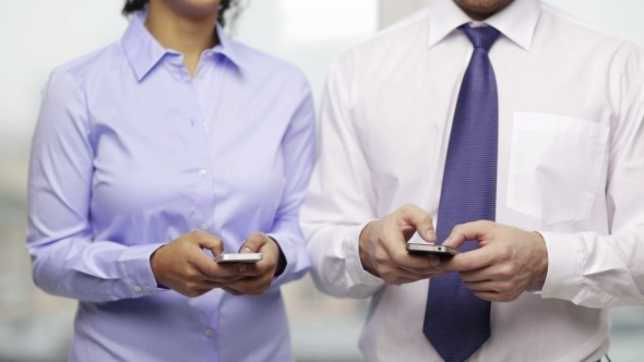 Business Man And Woman With Smartphones
