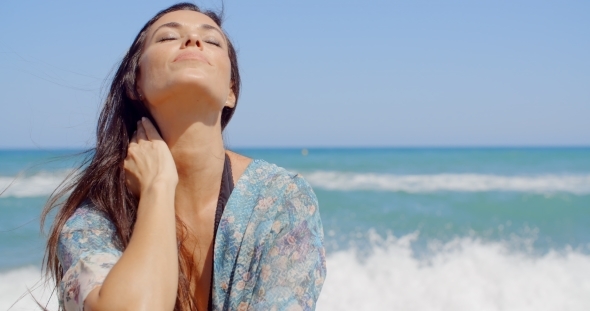 Sensual Woman At The Beach On a Tropical Climate