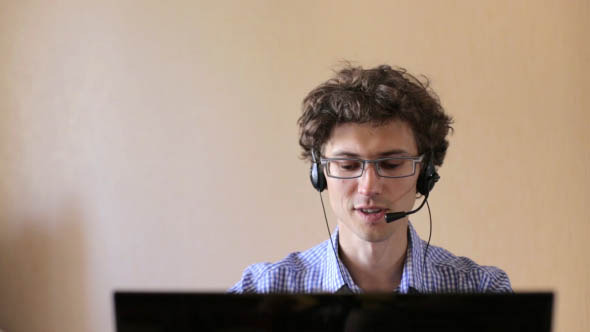 Customer Service Operator at Work in Call Center