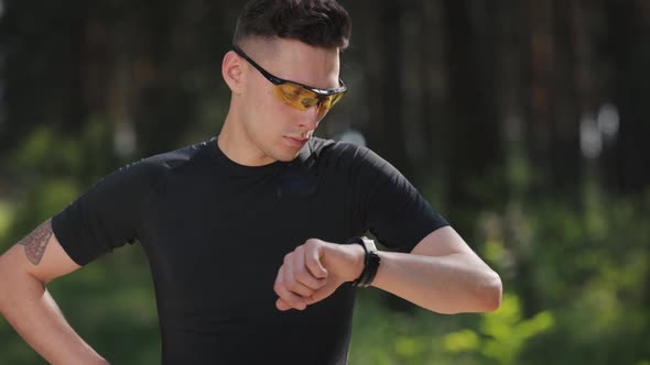 Man with Watch Running Outdoors