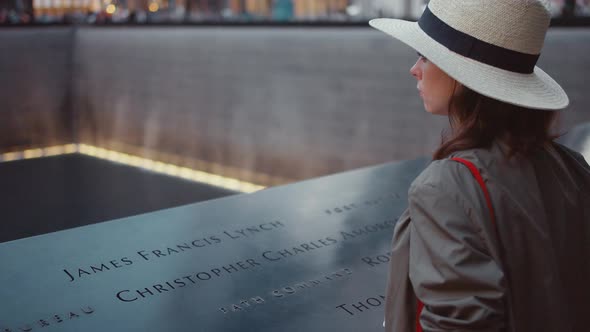 Young woman in the park at the 9/11 Memorial