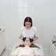 Cosmetologist Applies a Woman a Therapeutic Mask on Her Face - VideoHive Item for Sale