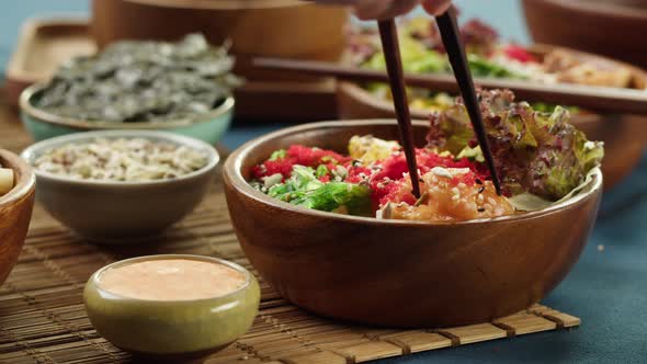 Eating Poke Bowl Closeup Taking Red Fish Using Chopsticks