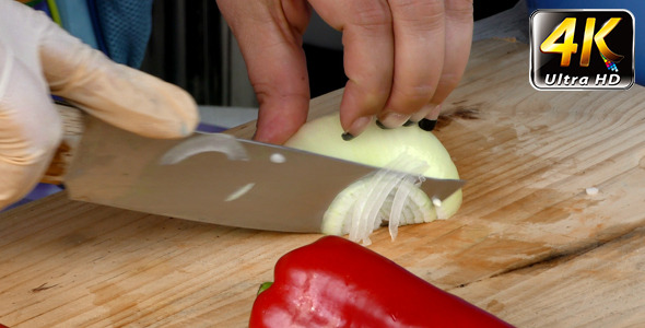 Chopping Onion on Wooden Plate 1