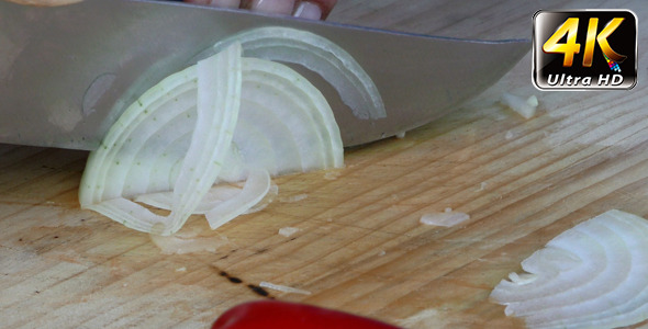 Chopping Onion on Wooden Plate 2
