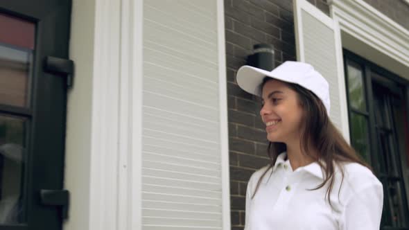 Smiling Deliverywoman Carrying Boxes of Pizza