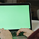 Girl Typing on Laptop with Green Screen - VideoHive Item for Sale